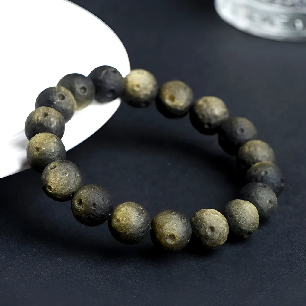 Natural obsidian crater ball bracelet with ground texture beads in silver or golden meteorite colours