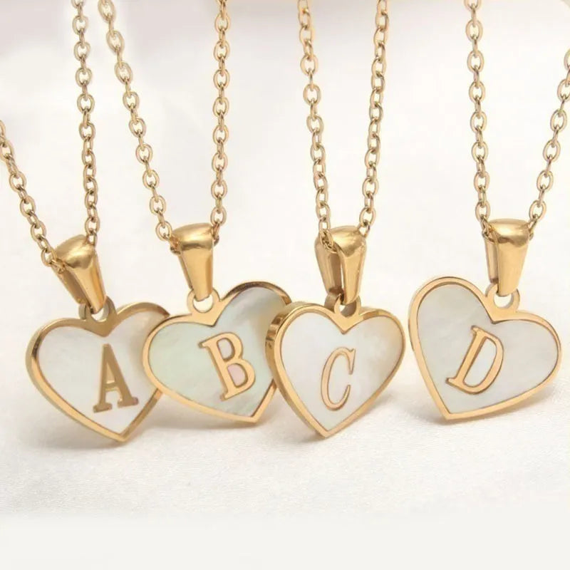 Gold-plated stainless steel necklace with a letter pendant and heart charm on a 45+5cm chain.