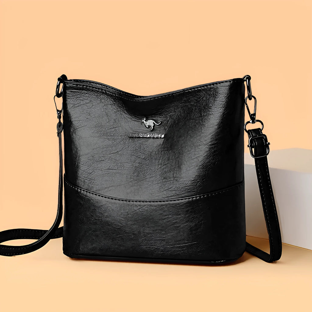 Women's soft leather shoulder bag in bucket design with large capacity and internal phone pocket