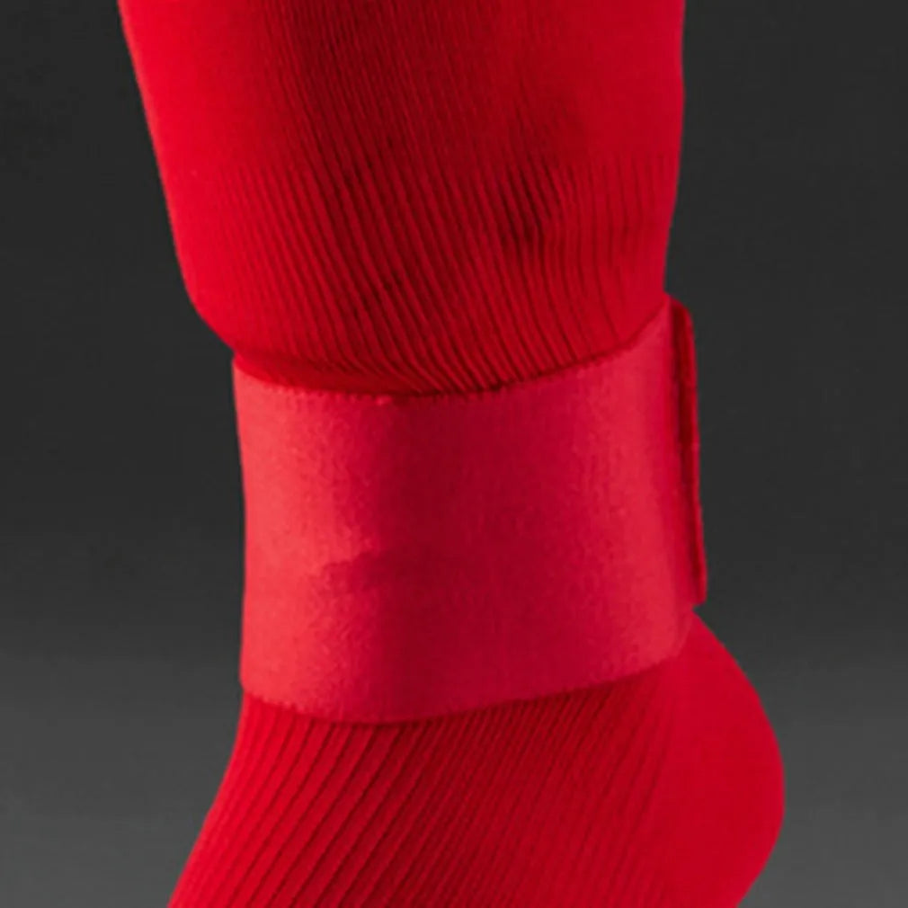 Rubber shin guard retention tape belt for football and cycling sports, shown in red.