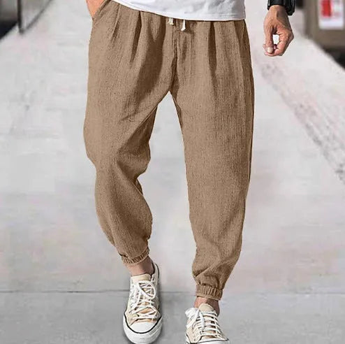 Men's loose cotton casual trousers with elasticated ankle bands in light green