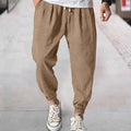 Men's loose cotton casual trousers with elasticated ankle bands in light green