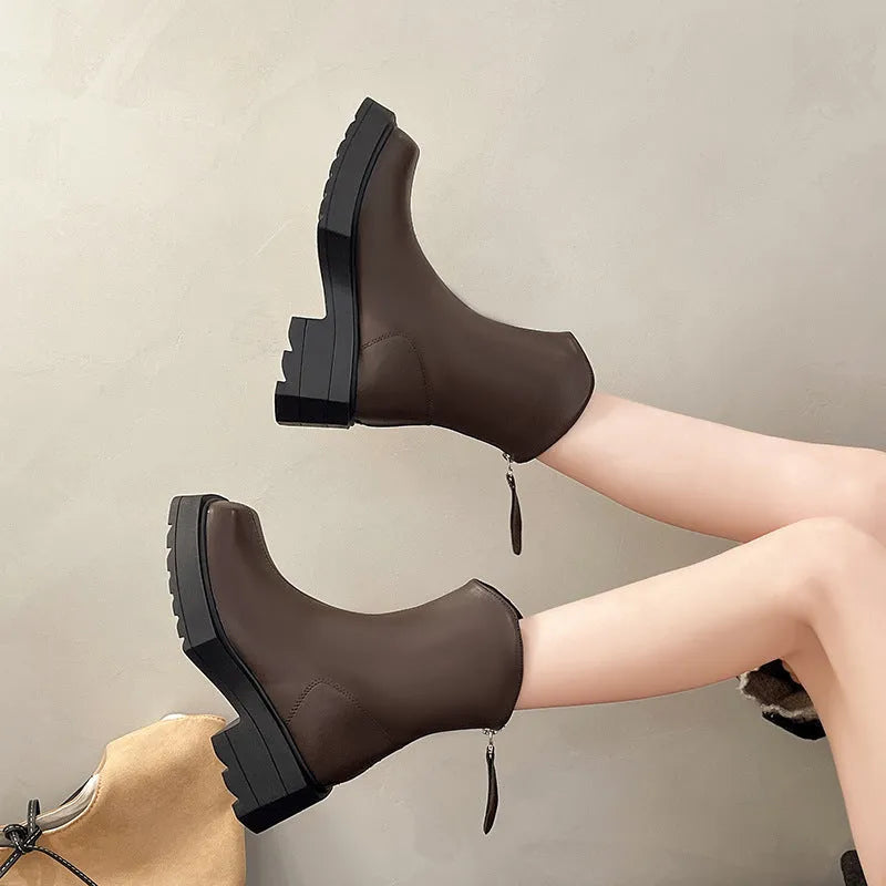 Black square toe platform Martin boots for women with a back zipper and mid-calf shaft.