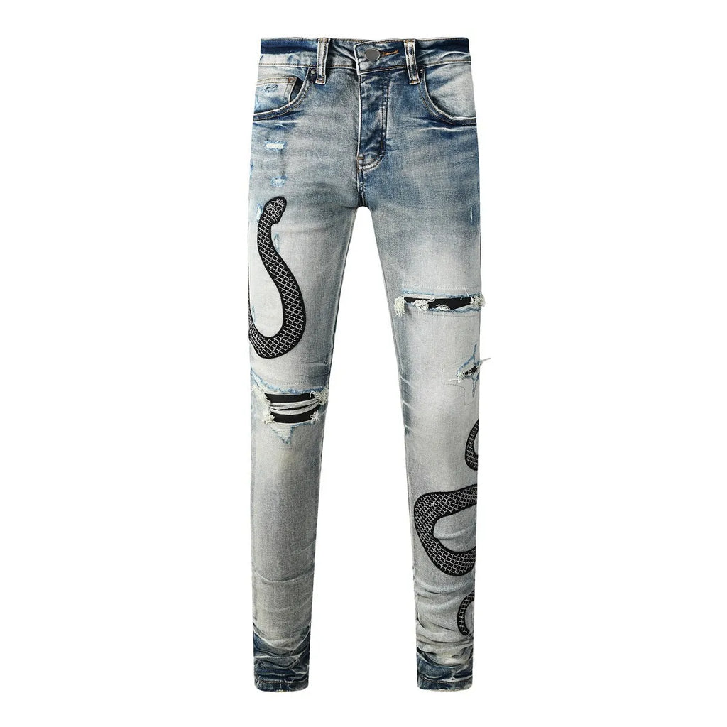 Distressed blue skinny jeans with tapered leg and button fly closure on mid-waist design