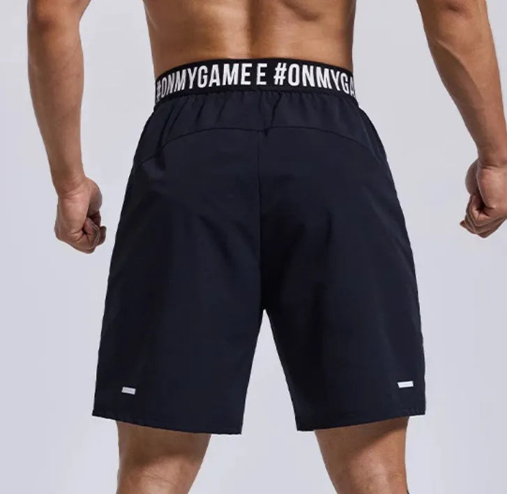 Men's loose fit cropped sports shorts in grey, blue or black with elastic waist