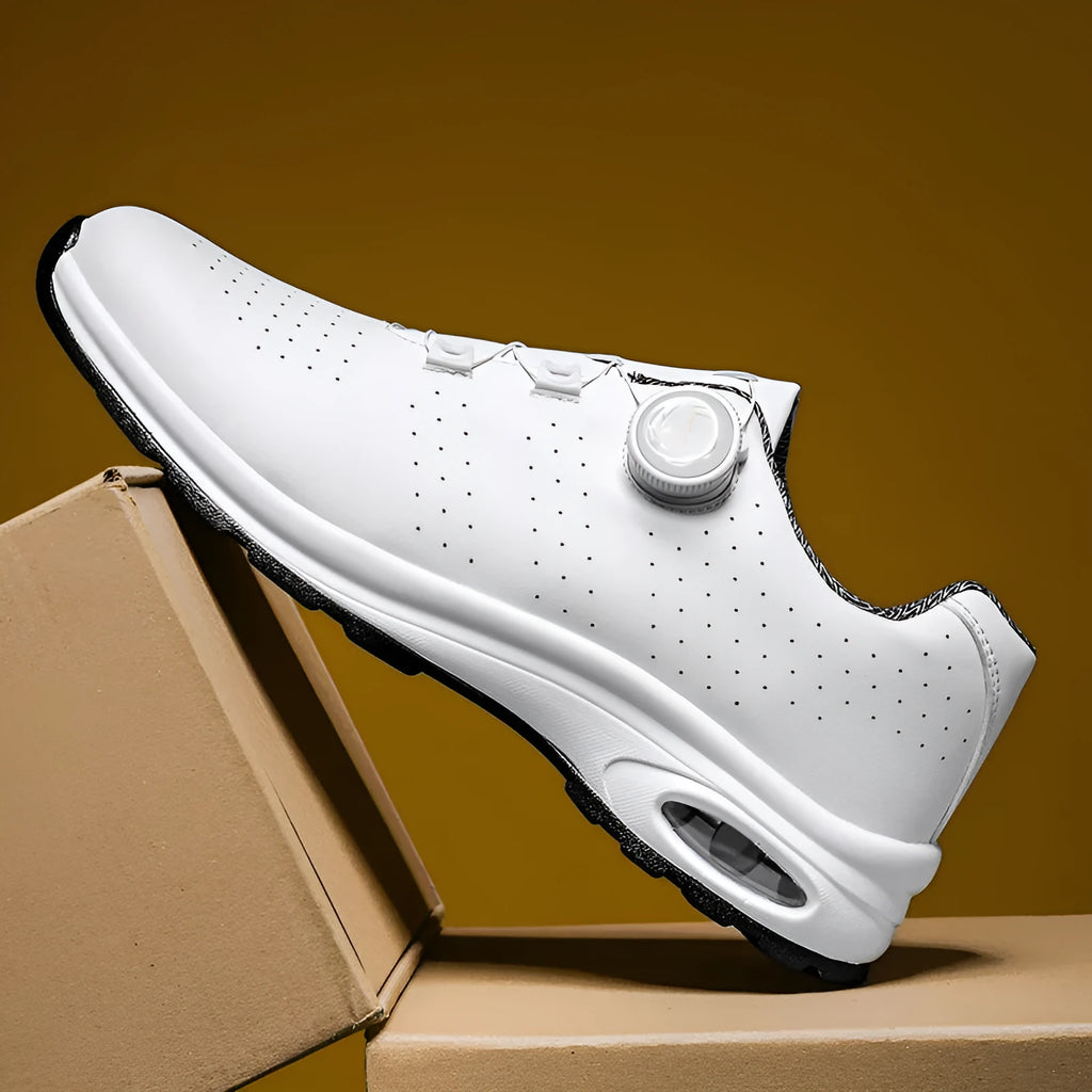 Women's black mesh low-top casual trainers with white cross-straps and a round toe, on a white background.