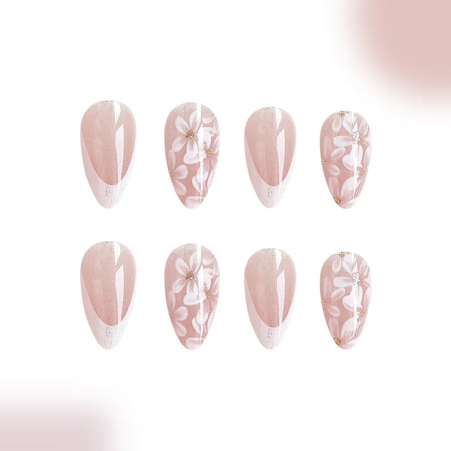 Removable short almond artificial nails with French style glitter flower design in colour C625