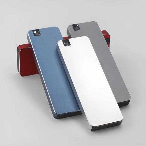 Compact silver portable solid state hard drive with USB cable on a dark surface
