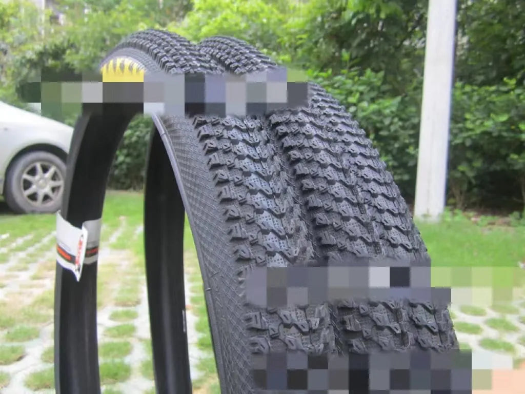 Ultralight mountain bike tyre with black tread, shown in 26, 27.5 and 29 inch sizes