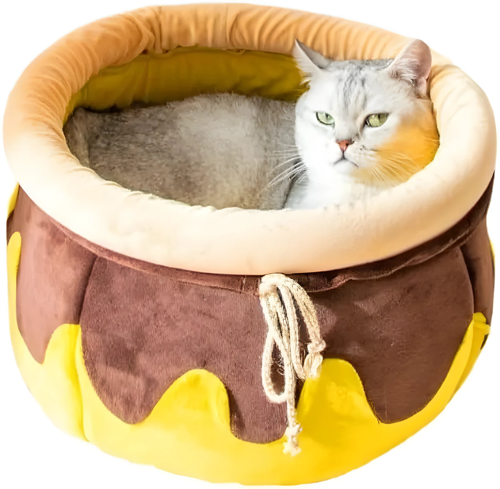 Pink honey pot-shaped cat sofa bed with a soft, removable grey nest pad inside.