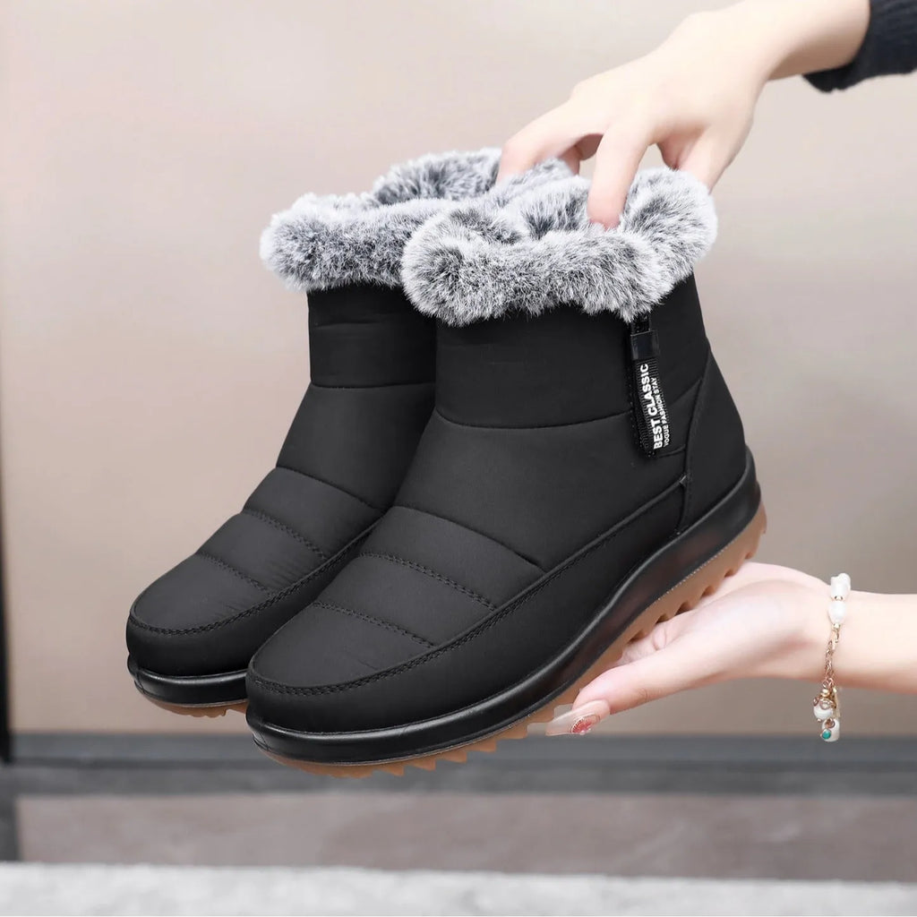 Women's winter ankle boot with side zipper and fleece lining, shown in black, dark brown, and red.