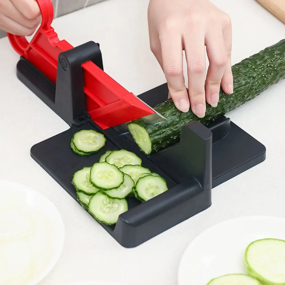 Green and red plastic vegetable cutter with stainless steel blades for slicing carrots and potatoes.