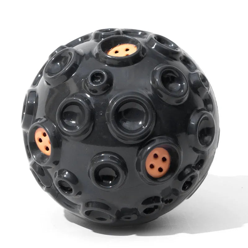 Colourful natural rubber dog chew ball with textured surface and meteorite-shaped bumps