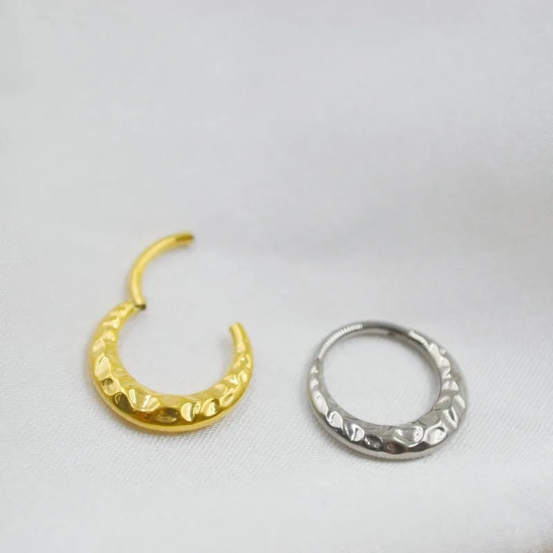 Titanium alloy concave-convex nose ring with carving detail in gold or silver colour.