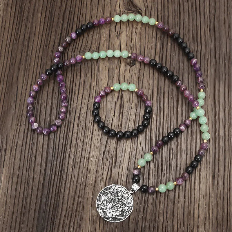 Geometric lotus pendant yoga necklace with stone bead chain and matching bracelet on white background