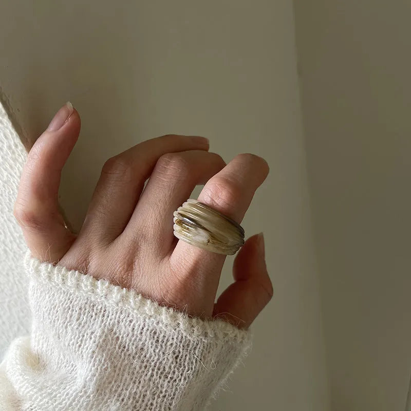 Geometric resin wide ring with irregular shape in retro Chinese style showing earthy colour options