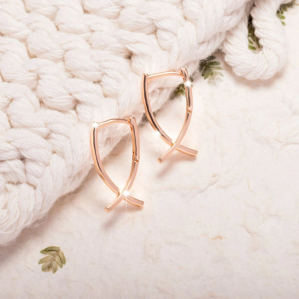 Rose gold cross shaped earrings on copper base with light luxury finish