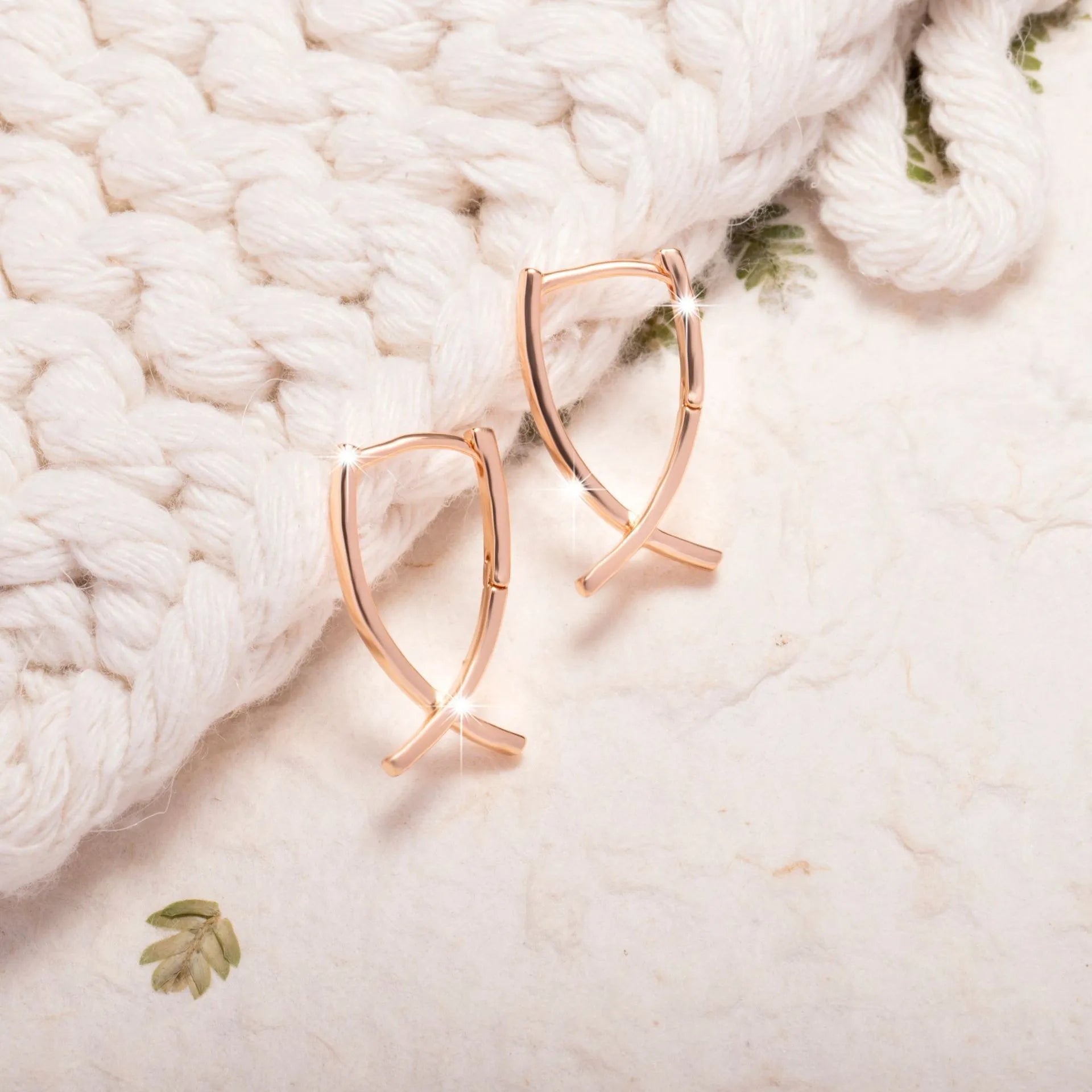 Rose gold cross shaped earrings on copper base with light luxury finish