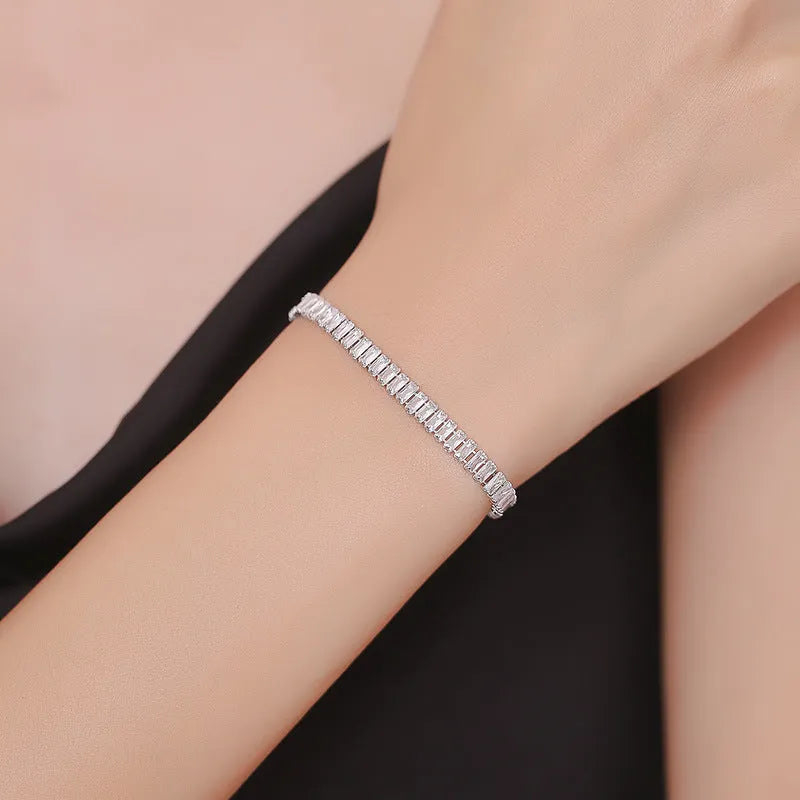 Women's brass bracelet with zircon inlaid geometric quadrilateral design in champagne gold finish