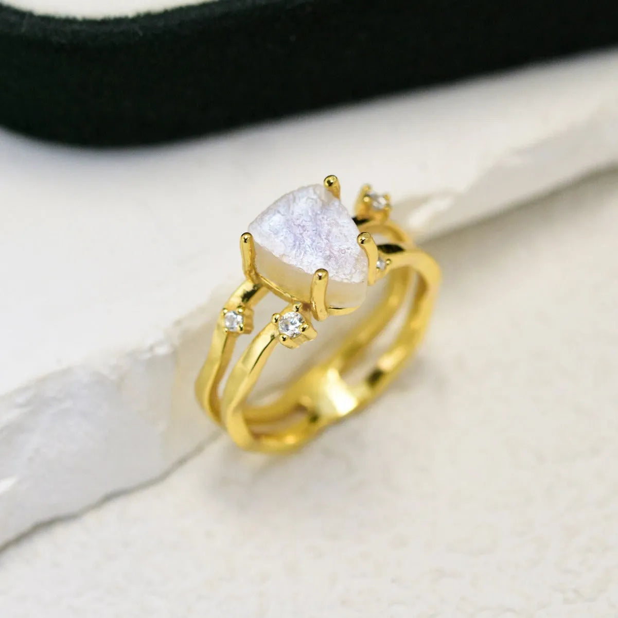 S925 sterling silver ring with triangular geometric design and central moonstone in gold tone plating