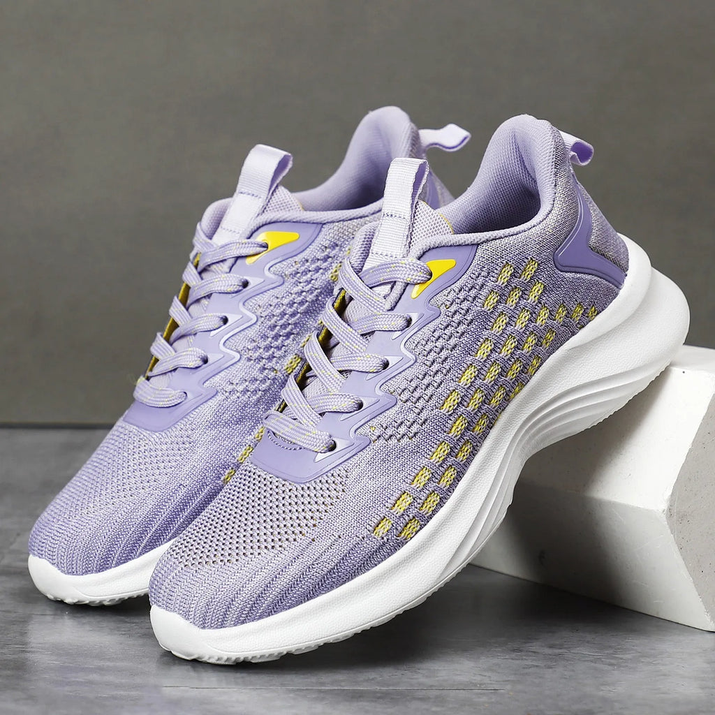 Women's lavender purple and blue Flyknit running shoes with mesh lining and striped pattern.