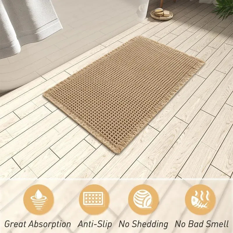 A checkered pattern non-slip polyester bathroom floor carpet shown in a beige colour.