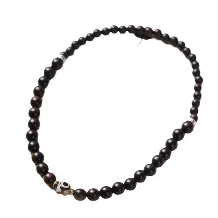 Ebony wood bracelet with 8mm beads and Tibetan two-circle pattern