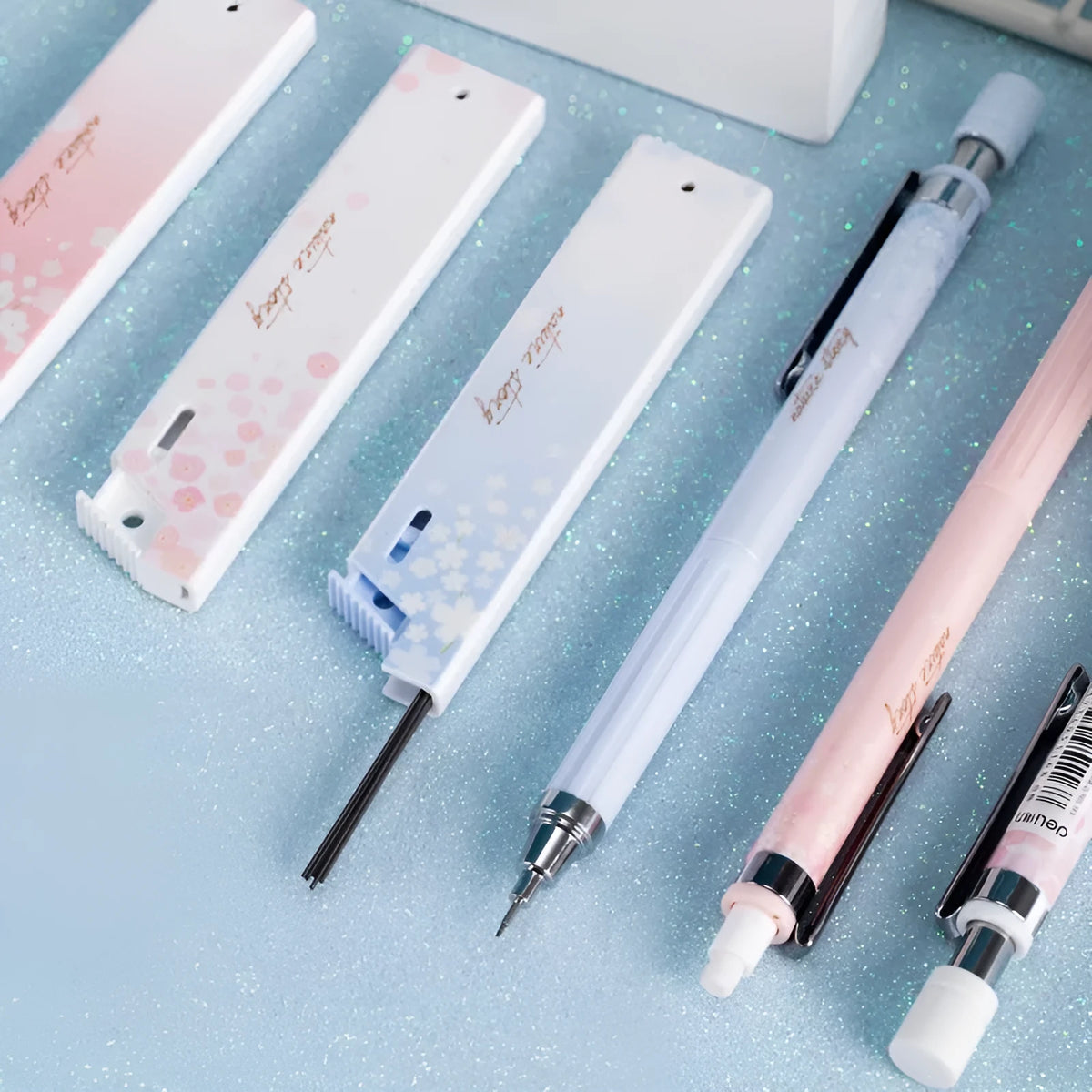 Simplified 0.5mm cartoon automatic pencil set with three pencils and HB refill boxes