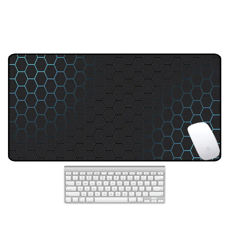 Large rectangular desk mouse pad with printed geometric pattern on a natural rubber non-slip base.