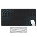 Large rectangular desk mouse pad with printed geometric pattern on a natural rubber non-slip base.