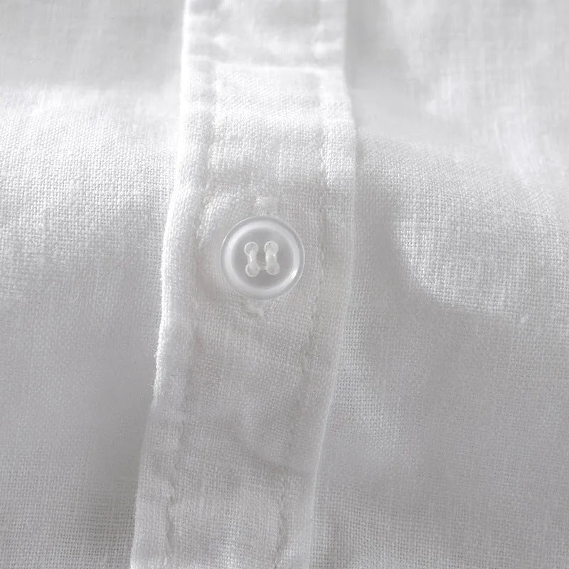 Men's loose fit short sleeve linen blend shirt in a solid colour, shown on a hanger.