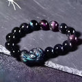 Natural ice colour Eye Obsidian crystal bracelet with elastic band, showing different bead size options.