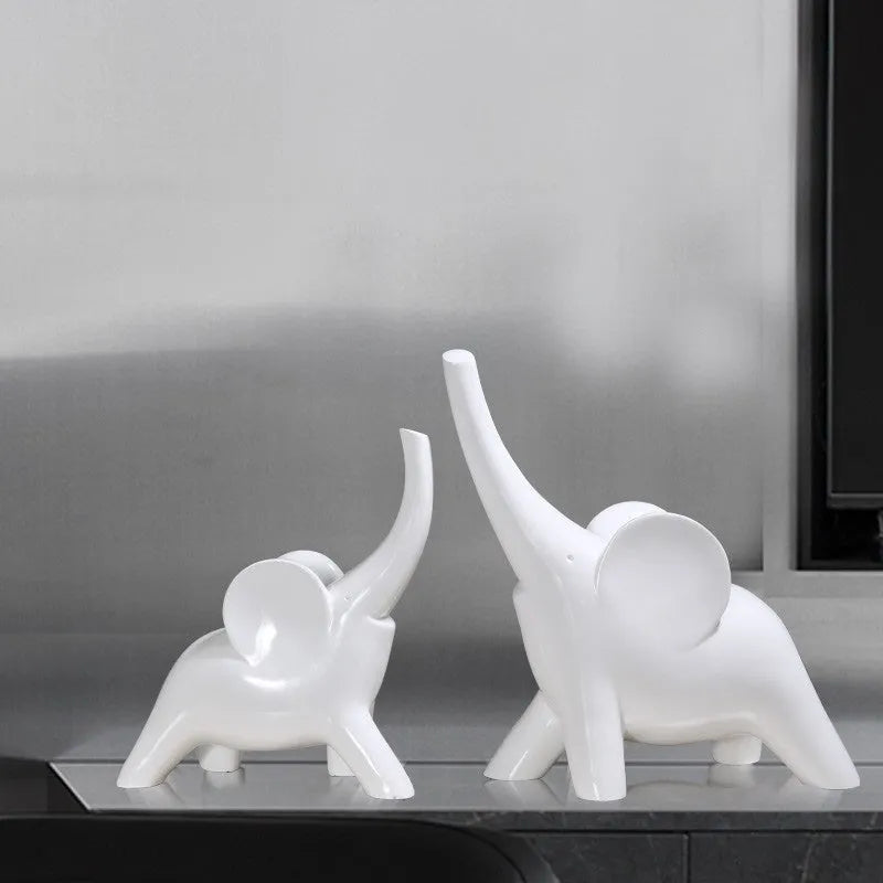 Modern resin fortune elephant ornament in rose gold or white colour, large and small sizes available.