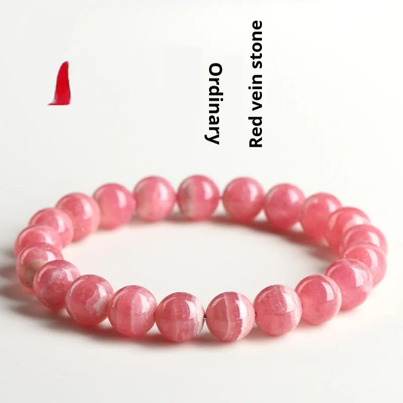 Women's geometric crystal bracelet with longevity lock in natural red rhodochrosite patterns showing angular bead shapes