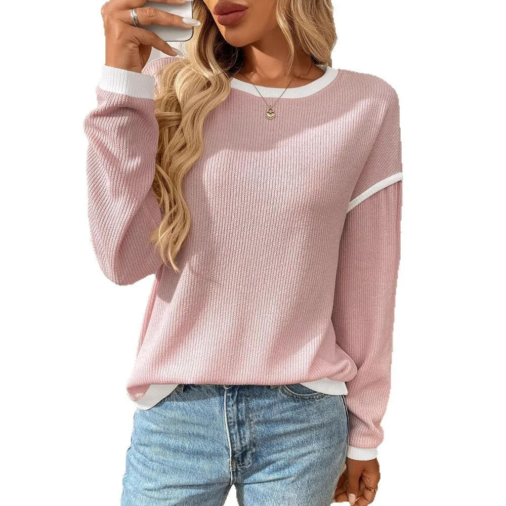 Women's loose fit polyester pullover top in light aqua blue with round neck and long sleeves.