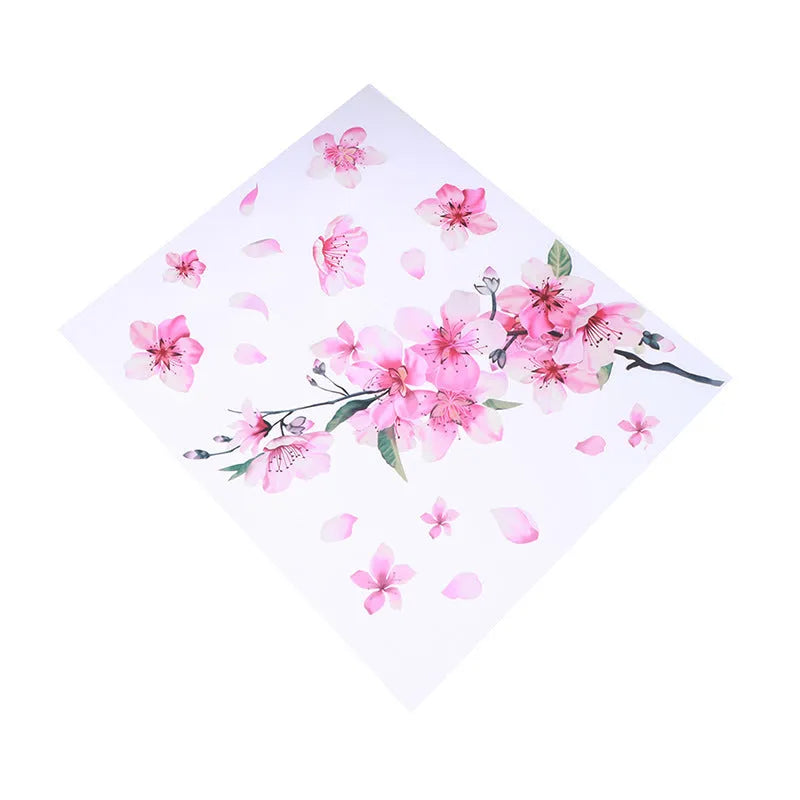 Close-up of a pink and white cherry blossom car sticker on a clear PVC backing.