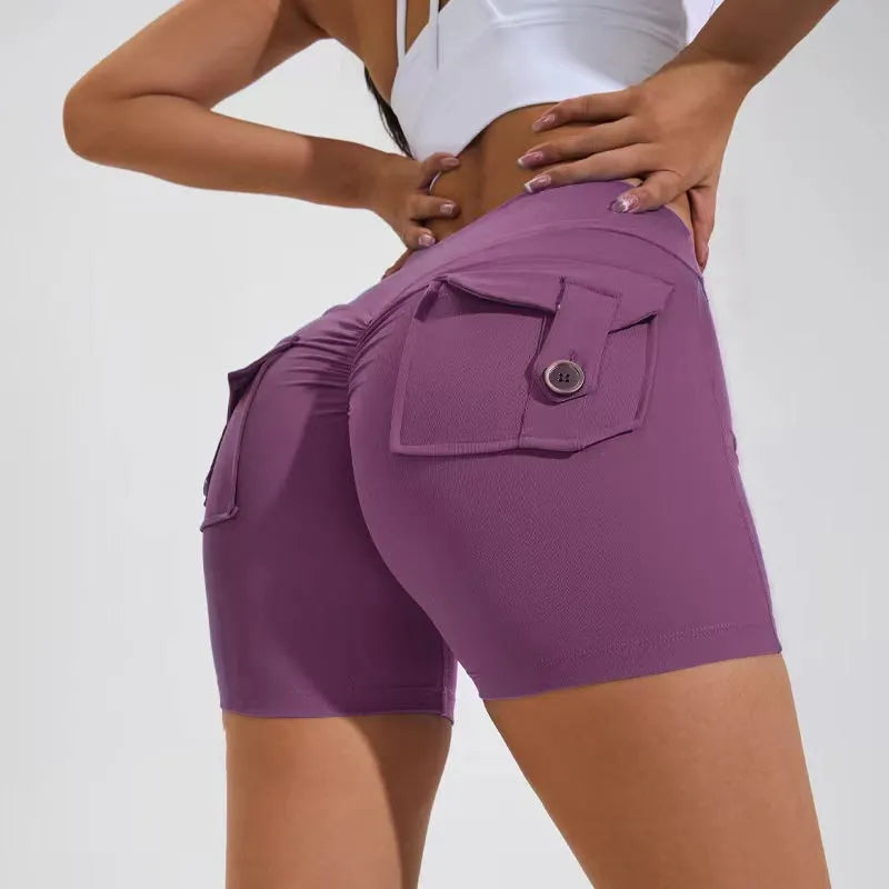 Women's high-waist fitness shorts in quick-dry nylon with side pockets, shown in Electric Blue.