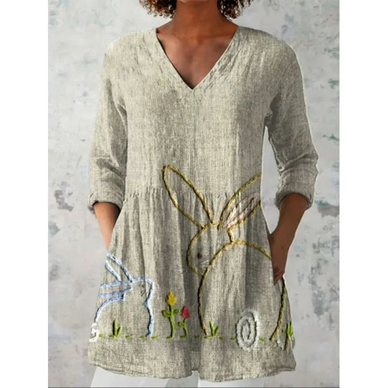 Women's loose-fitting printed dress with 3/4 sleeves and a wide waist design.