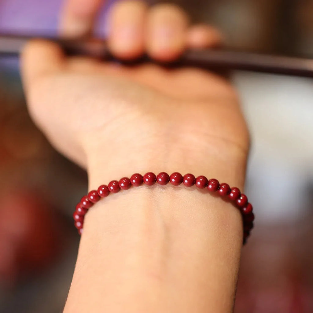 Handmade natural cinnabar bracelet with geometric auspicious patterns in purple gold sand colour