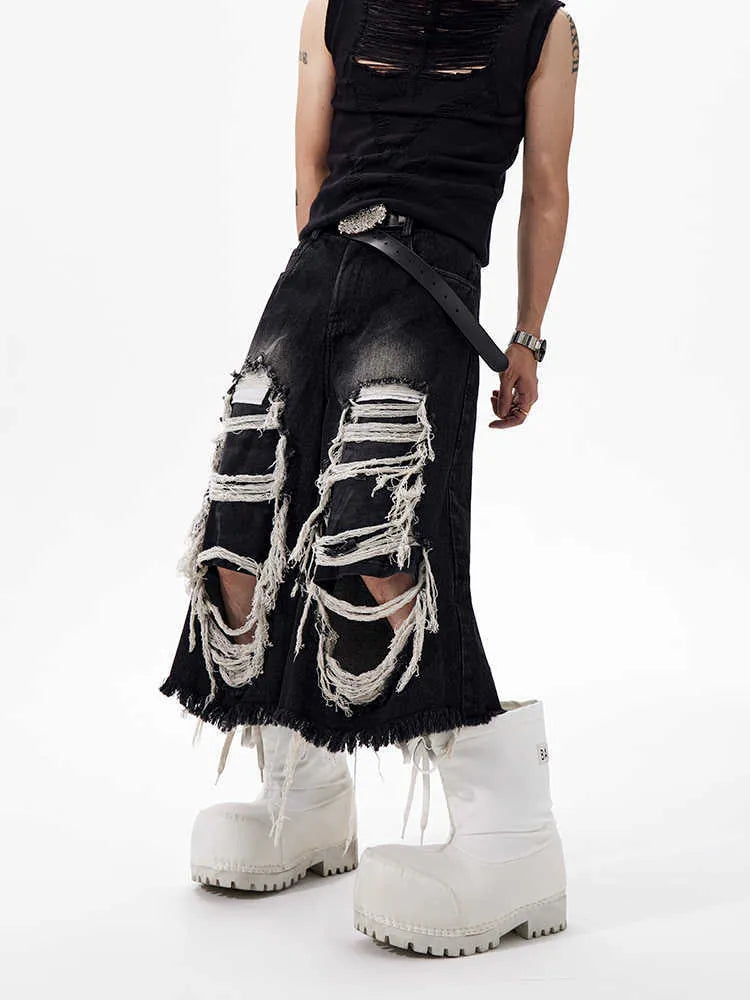 Black women's cropped wide-leg jeans with ripped patch details on a mid-high waist.