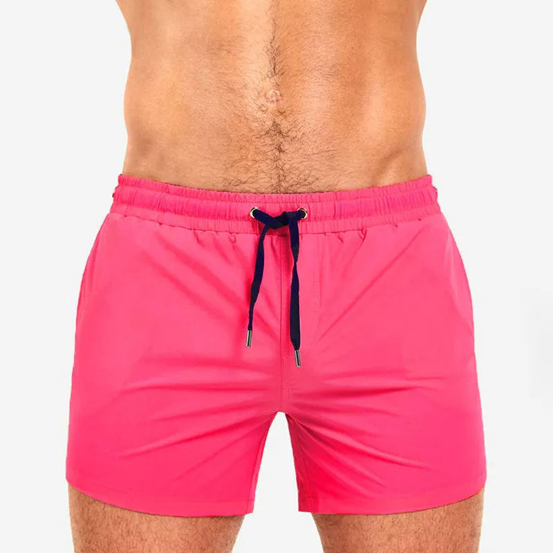 Men's solid colour swimming shorts with mesh lining for sports and fitness in Army Green.