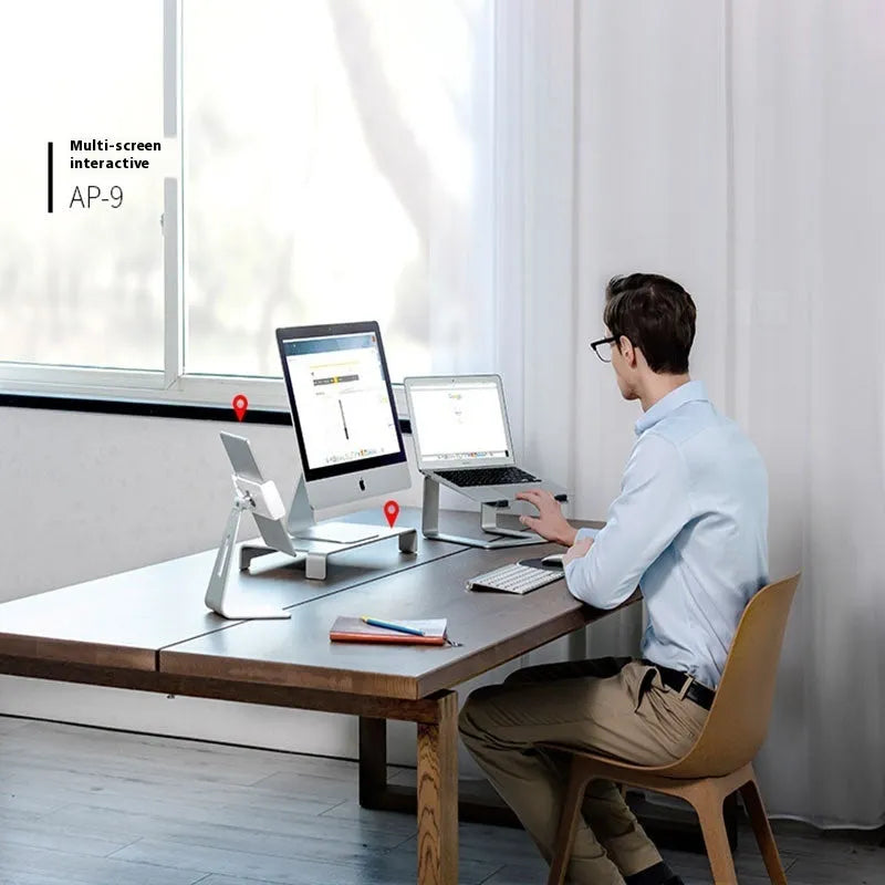 Black aluminium alloy laptop stand on a wooden desk