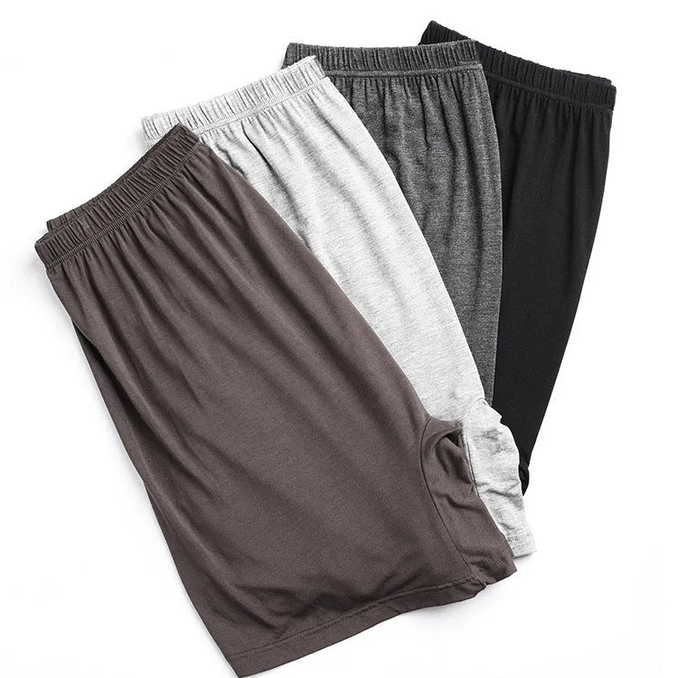 Men's solid colour high-waist boxers in modal fabric on size chart background