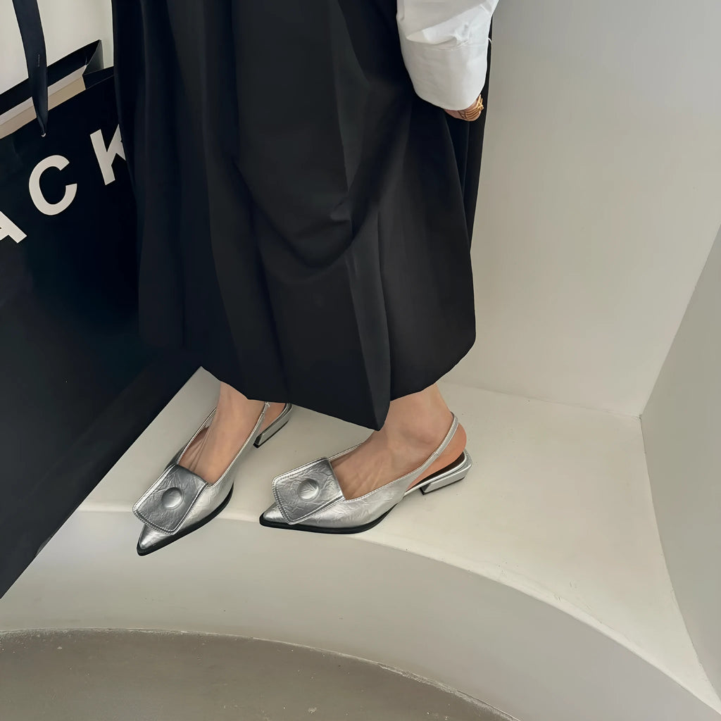 Women's low heel pointed toe sandals with an ankle strap in apricot colour.
