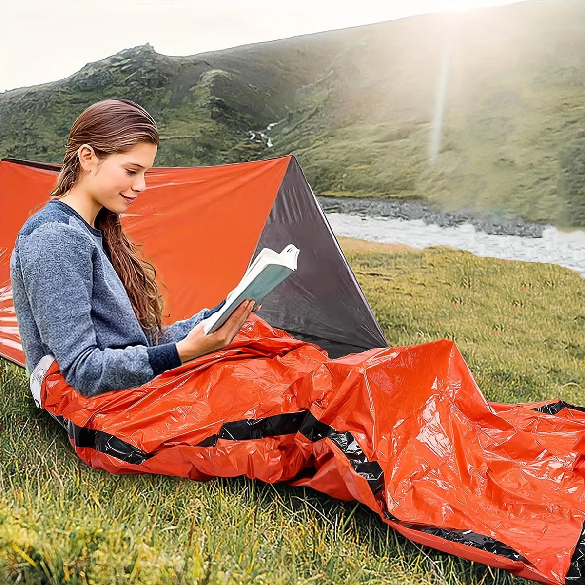 Portable emergency sleeping bag, blanket, and tent in green or orange, thermal and waterproof for camping and survival