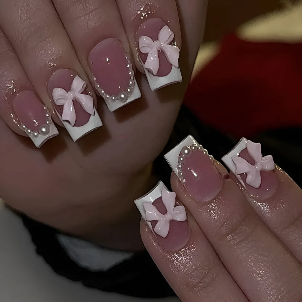 Short white French press-on nails with bow and tulip designs in European square shape