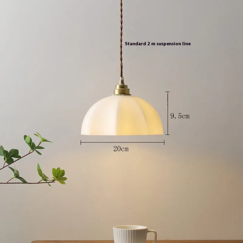 Brass Chinese style droplight with copper glass shade for bedside or dining room