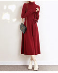Turtleneck knit dress with elastic waist and loose hem in polyester fabric, shown in solid colour options