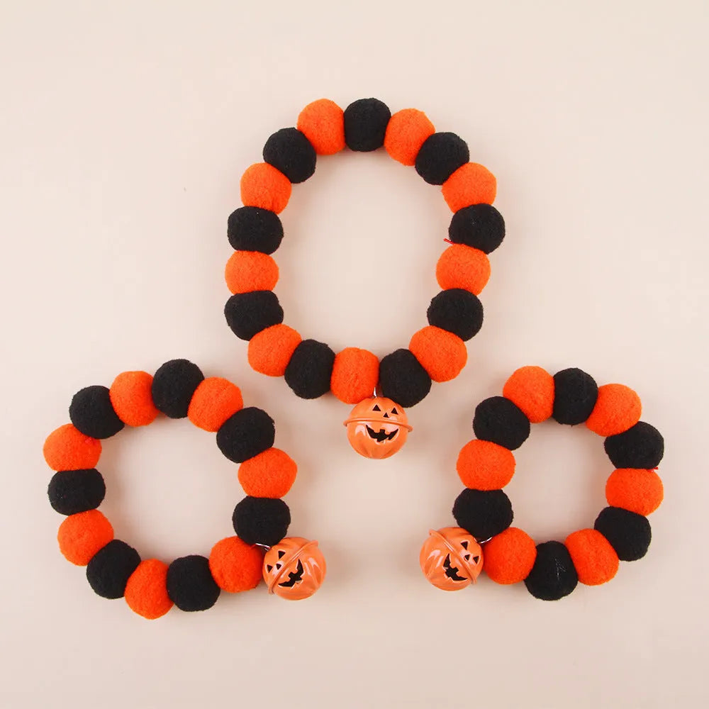 Orange and black Halloween pumpkin design on an adjustable cat collar for trick-or-treat.