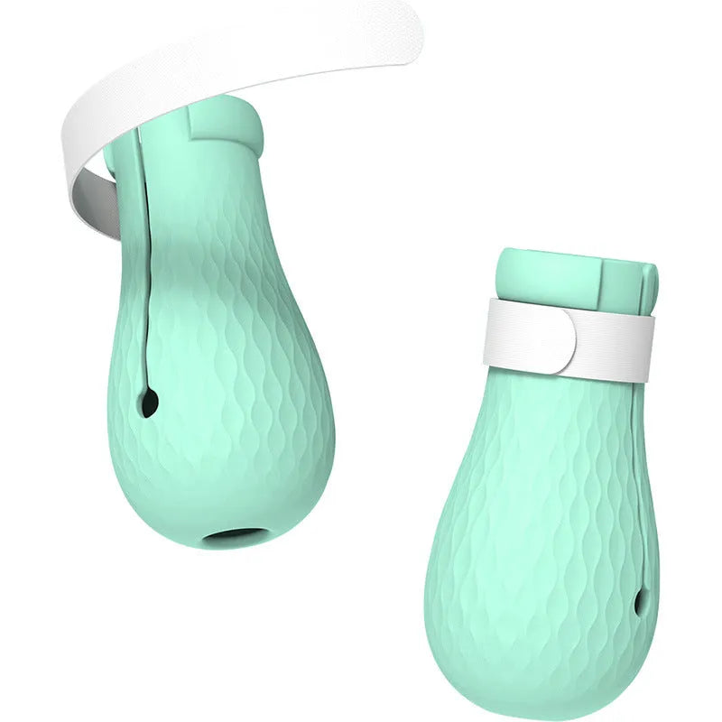 Four green silicone foot covers for protecting hands from cat scratches during pet care.
